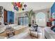 Bright, spacious living room boasts stylish furnishings, unique lighting, and an open floor plan, filled with natural light at 7436 Oak Grove Ave, Las Vegas, NV 89117