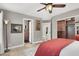 Main bedroom featuring a ceiling fan, a walk-in closet, with a view into a bathroom at 7436 Oak Grove Ave, Las Vegas, NV 89117