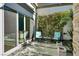 Charming patio area with comfortable seating and lush greenery, perfect for relaxation at 7436 Oak Grove Ave, Las Vegas, NV 89117