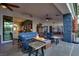 Inviting covered patio boasts a cozy fire pit, comfortable seating, and seamless indoor-outdoor living at 7436 Oak Grove Ave, Las Vegas, NV 89117