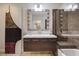Modern bathroom featuring a sleek vanity, contemporary lighting, and a glass shower at 7711 Spanish Lake Dr, Las Vegas, NV 89113