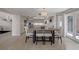 Dining area featuring modern table with eat-in kitchen including stainless steel appliances at 7711 Spanish Lake Dr, Las Vegas, NV 89113