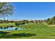 Expansive golf course with rolling green fairways and a tranquil lake at 7711 Spanish Lake Dr, Las Vegas, NV 89113