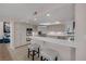 Open kitchen with an eat-in breakfast bar, stainless steel appliances and plenty of countertop space at 7711 Spanish Lake Dr, Las Vegas, NV 89113