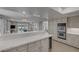 Open kitchen featuring stainless steel appliances, large countertop and breakfast bar at 7711 Spanish Lake Dr, Las Vegas, NV 89113