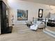 Open living area boasts a modern fireplace, neutral decor, and ample natural light at 7711 Spanish Lake Dr, Las Vegas, NV 89113