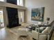 Inviting living room with fireplace, large windows, and comfortable seating at 7711 Spanish Lake Dr, Las Vegas, NV 89113
