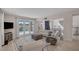 Living room with fireplace, golf course views and sliding door access to outdoor pool at 7711 Spanish Lake Dr, Las Vegas, NV 89113