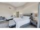 Large main bedroom suite with comfortable seating, dresser and calming decor at 7711 Spanish Lake Dr, Las Vegas, NV 89113