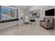 Cozy home office with built-in window seat, modern desk, and comfortable seating at 7711 Spanish Lake Dr, Las Vegas, NV 89113