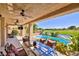 Charming covered patio with comfortable seating and clear view of the pool and golf course at 7711 Spanish Lake Dr, Las Vegas, NV 89113