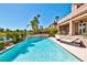 Inviting pool and spa area with manicured landscaping and comfortable lounge chairs, perfect for relaxation at 7711 Spanish Lake Dr, Las Vegas, NV 89113
