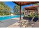 Inviting community pool area with covered cabanas and comfortable lounge chairs at 7711 Spanish Lake Dr, Las Vegas, NV 89113
