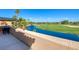 Breathtaking view of a lush golf course and serene lake from the balcony at 7711 Spanish Lake Dr, Las Vegas, NV 89113