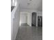 Bright entryway featuring neutral paint leading to the kitchen and open floor plan at 7745 Tyrell Peaks St, Las Vegas, NV 89139