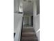 Bright hallway featuring neutral paint and carpeted stairs leading to upper level at 7745 Tyrell Peaks St, Las Vegas, NV 89139