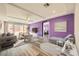 Living room boasts an open layout, ceiling fan, and lots of natural light at 7745 Tyrell Peaks St, Las Vegas, NV 89139