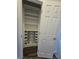 Organized pantry features built-in shelving and convenient pull-out wire baskets at 7745 Tyrell Peaks St, Las Vegas, NV 89139
