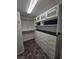 Walk-in closet with built in shelving and drawers with plenty of storage space at 7745 Tyrell Peaks St, Las Vegas, NV 89139