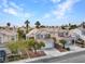 Aerial view of homes featuring tile roofs and desert landscaping in a well-maintained community at 8005 Dover Shores Ave, Las Vegas, NV 89128