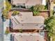 Overhead view of homes featuring desert landscaping, concrete driveway, and tile roof at 8005 Dover Shores Ave, Las Vegas, NV 89128