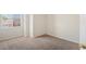 Bright bedroom with large window, carpeted floor, and neutral paint, ready for personalization at 8005 Dover Shores Ave, Las Vegas, NV 89128