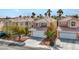 Charming two-story home featuring a two-car garage, desert landscaping and a cozy front yard at 8005 Dover Shores Ave, Las Vegas, NV 89128