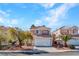 Charming two-story home featuring a tile roof and well-maintained landscaping at 8005 Dover Shores Ave, Las Vegas, NV 89128