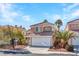 Attractive two-story home with desert landscaping and ample parking space at 8005 Dover Shores Ave, Las Vegas, NV 89128