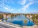 Picturesque community view on a lake with palm trees along the shoreline at 8005 Dover Shores Ave, Las Vegas, NV 89128