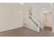 Living room with a staircase and stylish lighting fixture at 8005 Dover Shores Ave, Las Vegas, NV 89128