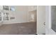 Bright living room with neutral carpet and large windows for natural light at 8005 Dover Shores Ave, Las Vegas, NV 89128