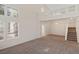 Spacious living room featuring high ceilings and a staircase to the second floor at 8005 Dover Shores Ave, Las Vegas, NV 89128