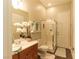A well-lit bathroom showcasing a vanity with towels and a walk-in shower at 809 Lake Hill Dr, Boulder City, NV 89005
