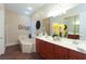 Bathroom featuring dual vanities, a soaking tub, and elegant fixtures for a luxurious experience at 809 Lake Hill Dr, Boulder City, NV 89005