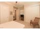 An inviting bedroom has neutral colors, a comfy chair and a serene atmosphere at 809 Lake Hill Dr, Boulder City, NV 89005