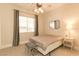 Well lit bedroom featuring window, small bench, and a cozy contemporary design at 809 Lake Hill Dr, Boulder City, NV 89005