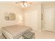 Well lit bedroom featuring window, small bench, and contemporary design at 809 Lake Hill Dr, Boulder City, NV 89005