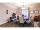Cozy dining area featuring a round table, tufted chairs, and elegant chandelier lighting at 809 Lake Hill Dr, Boulder City, NV 89005