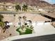 Charming single-story home featuring a well-manicured front yard, desert landscaping, and an attached two-car garage at 809 Lake Hill Dr, Boulder City, NV 89005