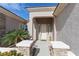 Inviting front entrance showcasing decorative stone columns and a covered porch with side-light windows at 809 Lake Hill Dr, Boulder City, NV 89005