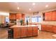 Beautiful kitchen island with seating, a view from the window, and abundant cabinet space at 809 Lake Hill Dr, Boulder City, NV 89005
