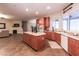 Open kitchen featuring a center island, modern appliances, and seamless flow to the living room at 809 Lake Hill Dr, Boulder City, NV 89005