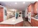 The kitchen island has countertop space and leads into an open living area with a fireplace and couch at 809 Lake Hill Dr, Boulder City, NV 89005