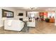 Open living room featuring tile floors, fireplace, and a view of the dining and kitchen areas at 809 Lake Hill Dr, Boulder City, NV 89005