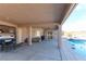 Large covered patio is perfect for outdoor living, next to a pool, hot tub, and boat parking at 809 Lake Hill Dr, Boulder City, NV 89005