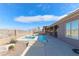 Backyard featuring a pool, hot tub, covered patio, and a fenced yard overlooking the landscape at 809 Lake Hill Dr, Boulder City, NV 89005