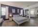 Serene bedroom with a full-size bed, mirrored closet, and a desk setup at 8198 Palmada Dr, Las Vegas, NV 89123