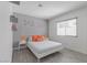 Inviting bedroom with a simple white bed frame and vibrant butterfly decor at 8198 Palmada Dr, Las Vegas, NV 89123