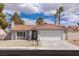Charming single-story home with a well-manicured front yard and a two-car garage at 8198 Palmada Dr, Las Vegas, NV 89123